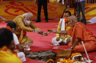 Indian Prime Minister Narendra Modi performs rituals during the groundbreaking ceremony of a temple dedicated to the Hindu god Ram, in Ayodhya, India, Wednesday, Aug. 5, 2020.