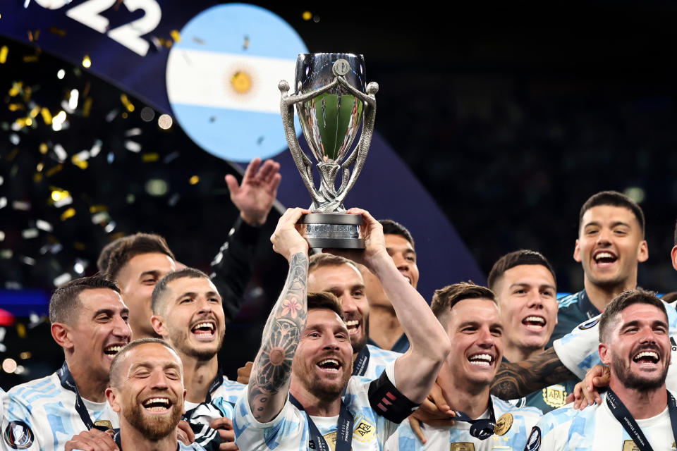 Seen here, Argentina captain Lionel Messi holds the trophy aloft as he celebrates with teammates after beating Italy 3-0 to win the 2022 Finalissima.