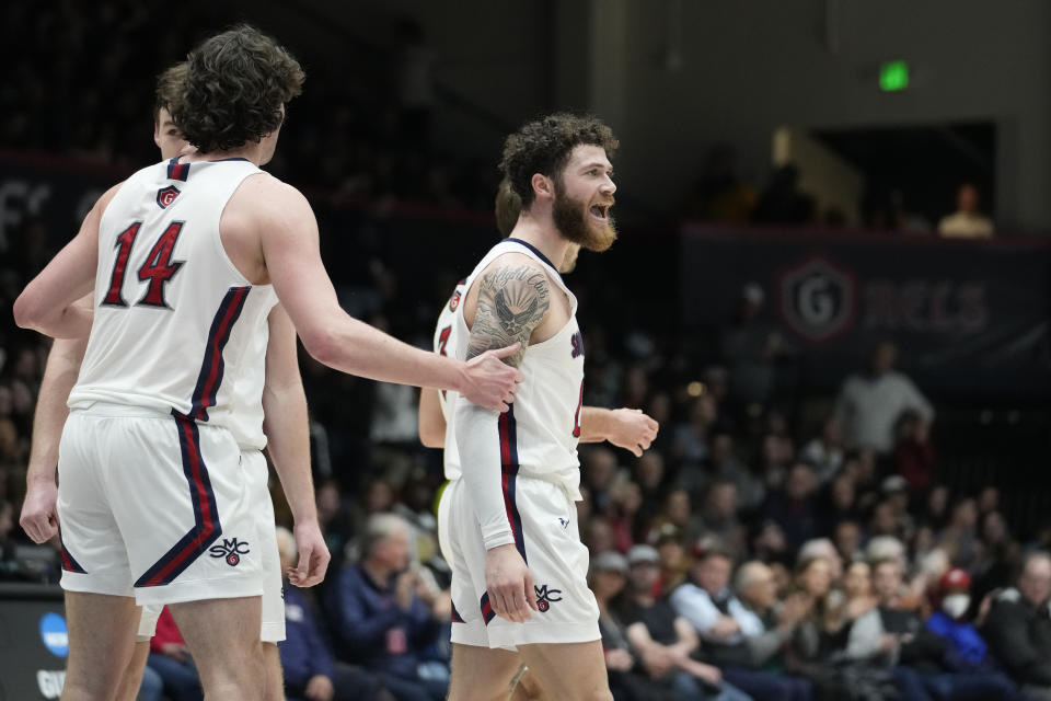 Saint Mary's guard Logan Johnson, right, reacts during the first half of an NCAA college basketball game against Pacific in Moraga, Calif., Thursday, Feb. 23, 2023. (AP Photo/Godofredo A. Vásquez)