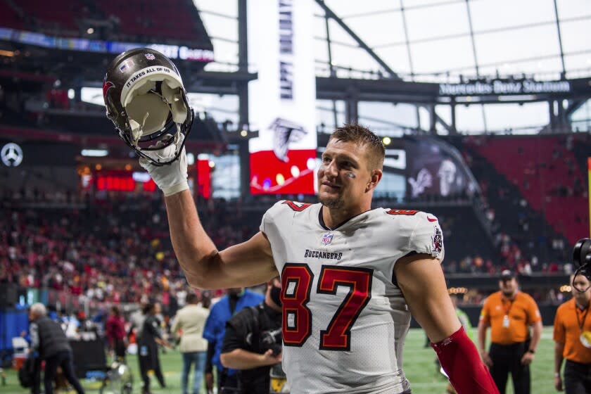 FILE - Tampa Bay Buccaneers tight end Rob Gronkowski (87) waves to fans after an NFL football game.