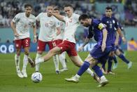 Argentina's Lionel Messi takes a shot during the World Cup group C soccer match between Poland and Argentina at the Stadium 974 in Doha, Qatar, Wednesday, Nov. 30, 2022. (AP Photo/Jorge Saenz)