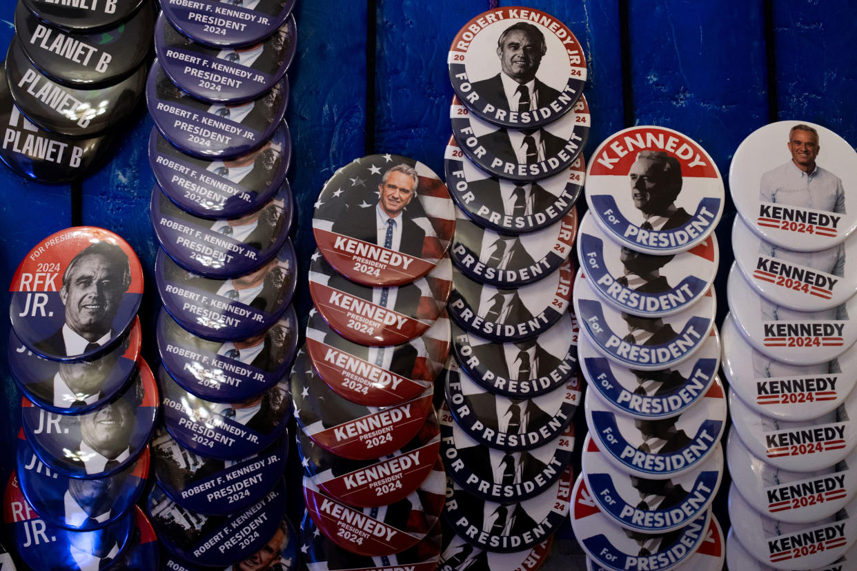 Pins and other merchandise in support of Independent presidential candidate Robert F. Kennedy Jr. on display during a voter rally at St. Cecilia Music Center in Grand Rapids, Mich., on Feb. 10, 2024.<span class="copyright">Emily Elconin—Getty Images</span>