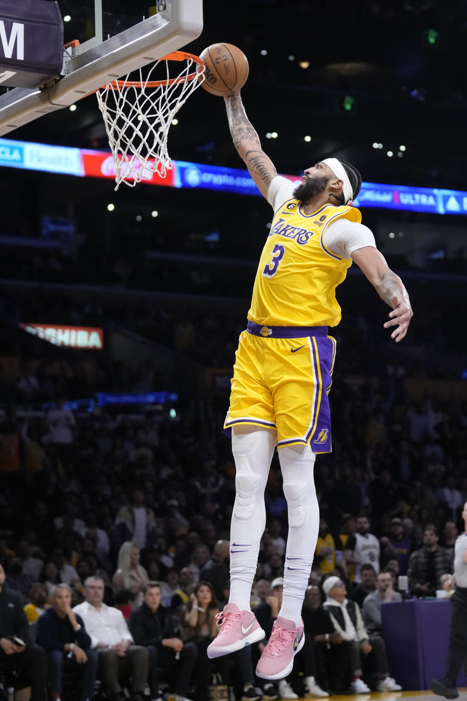 Los Angeles Lakers forward Anthony Davis scores on a breakaway dunk during the first half of an NBA basketball play-in tournament game against the Minnesota Timberwolves Tuesday, April 11, 2023, in Los Angeles. (AP Photo/Marcio Jose Sanchez)