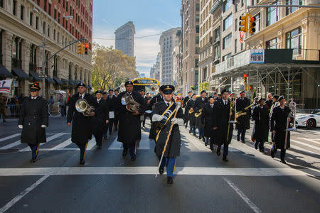 Brian Endlein (C), of the U.S. Army Reserve 78th Army Band, leads the band in marching during the annual New York City Veterans Day Parade in New York, NY, U.S., November 11, 2017. Picture taken November 11, 2017. Hector Rene Membreno-Canales/U.S. Army/Handout via REUTERS