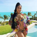 <p>Also at the beach, Nicki Minaj strikes a pose poolside in Turks and Caicos with a stunning turquoise ocean as her backdrop. </p>