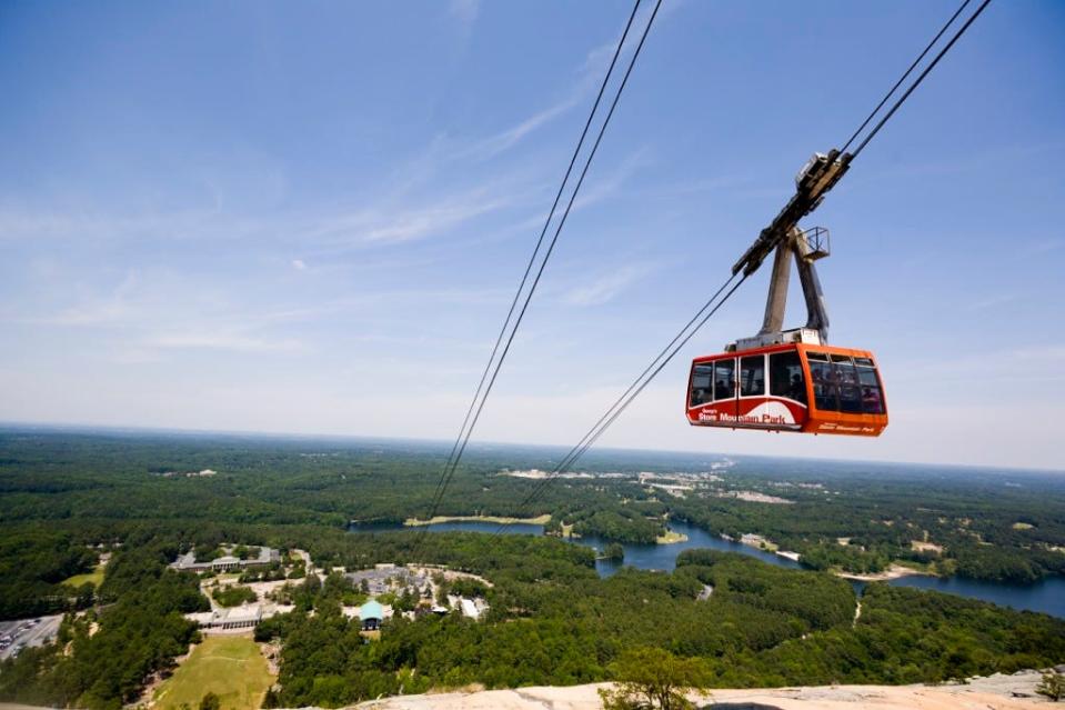 FILE - Stone Mountain Park is hosting multiple themed-events this time of year in addition to the regular amenities like the cable car that brings guests up and down the 825-foot-tall Stone Mountain.