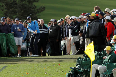 FILE PHOTO: Henrik Stenson of Sweden chips from the crowd onto the 18th green in first round play during the 2017 Masters golf tournament at Augusta National Golf Club in Augusta, Georgia, U.S., April 6, 2017. REUTERS/Jonathan Ernst/File Photo