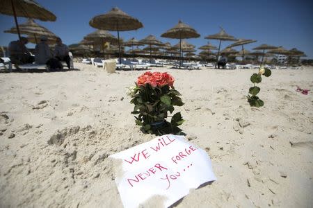 Flowers are laid at the beachside of the Imperial Marhaba resort, which was attacked by a gunman in Sousse, Tunisia, June 28, 2015. REUTERS/Zohra Bensemra