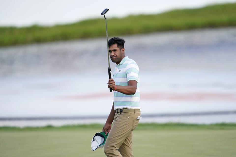 Tony Finau acknowledges applause from the gallery after his win in the 3M Open golf tournament at the Tournament Players Club in Blaine, Minn., Sunday, July 24, 2022. (AP Photo/Abbie Parr)