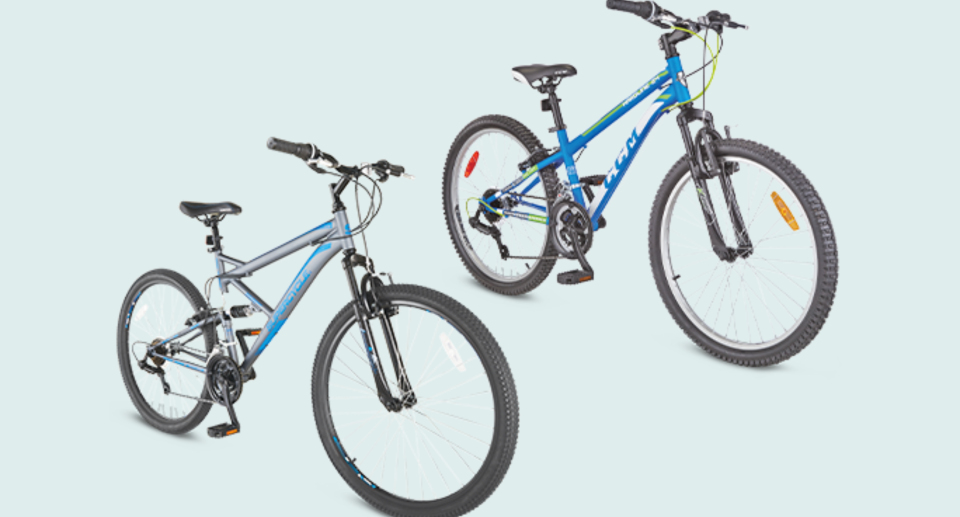 two bikes from canadian tire on light blue background