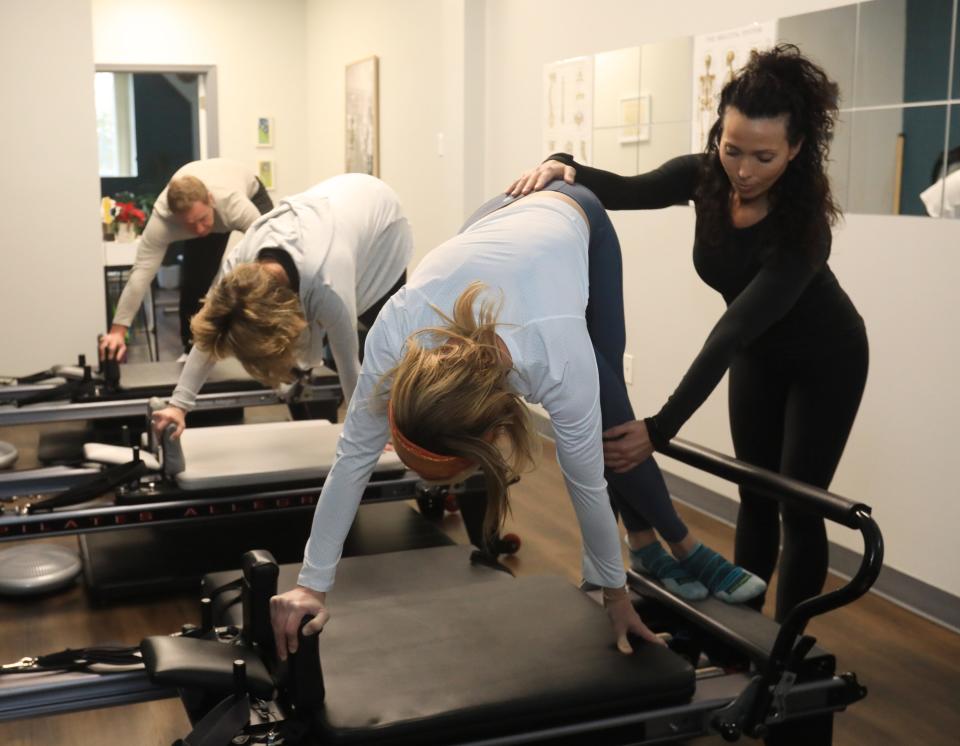 Brenda Basteiro guides Raleigh Busser during a reformer Pilates session at RB Pilates studio in Cornwall on January 23, 2024. Basteiro is the process of opening a Club Pilates in the Town of Poughkeepsie.