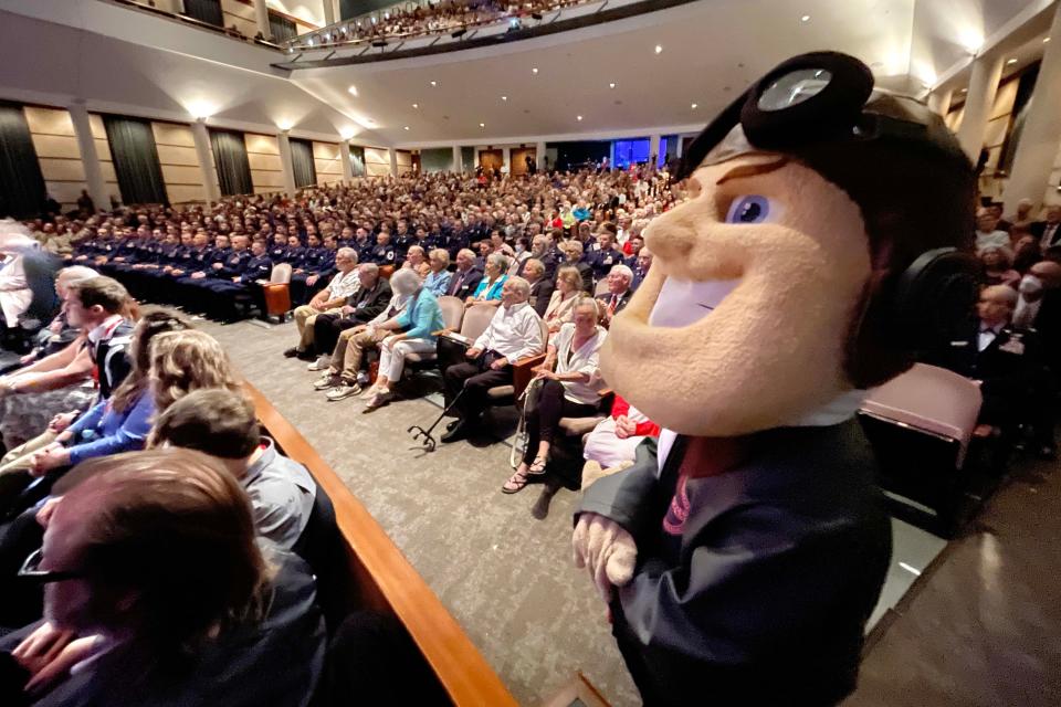 Northwest Florida State College mascot "Jimmy Raider" and others fill the Mattie Kelly Arts Center in Niceville on Monday during a final ceremonial toast to the Doolittle Raiders.