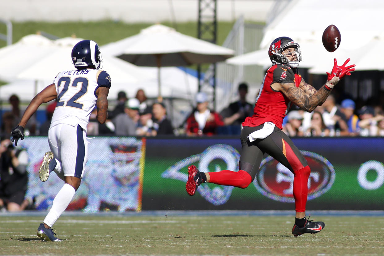 Wide receiver Mike Evans #13 of the Tampa Bay Buccaneers catches a long touchdown pass against the Rams. (Getty Images)