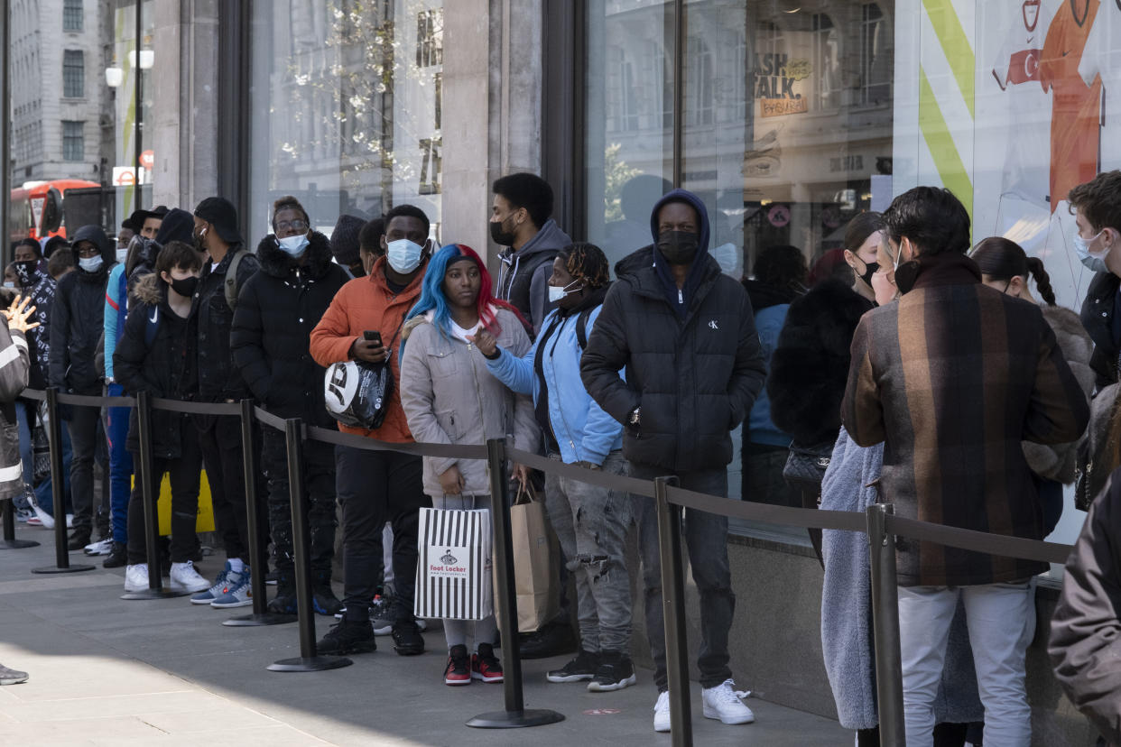 Shoppers queue to enter Nike Town on Oxford Street as non-essential shops reopen and the national coronavirus lockdown three eases on 12th April 2021 in London, United Kingdom. Now that the roadmap for coming out of the national lockdown has been laid out, this is the first phase of the easing of restrictions, and large numbers of people are out in London's retail district to go shopping. (photo by Mike Kemp/In Pictures via Getty Images)