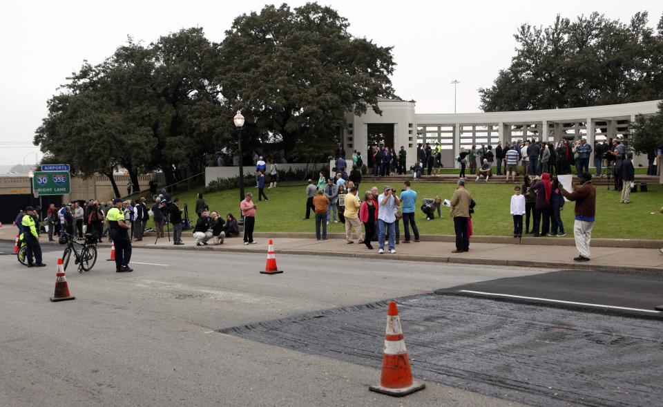 Crowds gather in Dealey Plaza at the spot of the 1963 assassination of U.S. President John F. Kennedy one day before commemorations of the 50th anniversary of the assassination in Dallas