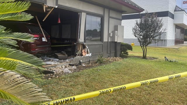 Police tape is shown in front of a Denny's restaurant.