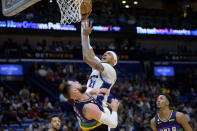 Washington Wizards center Daniel Gafford (21) shoots against New Orleans Pelicans center Jonas Valanciunas (17) in the first half of an NBA basketball game in New Orleans, Saturday, Jan. 28, 2023. (AP Photo/Matthew Hinton)