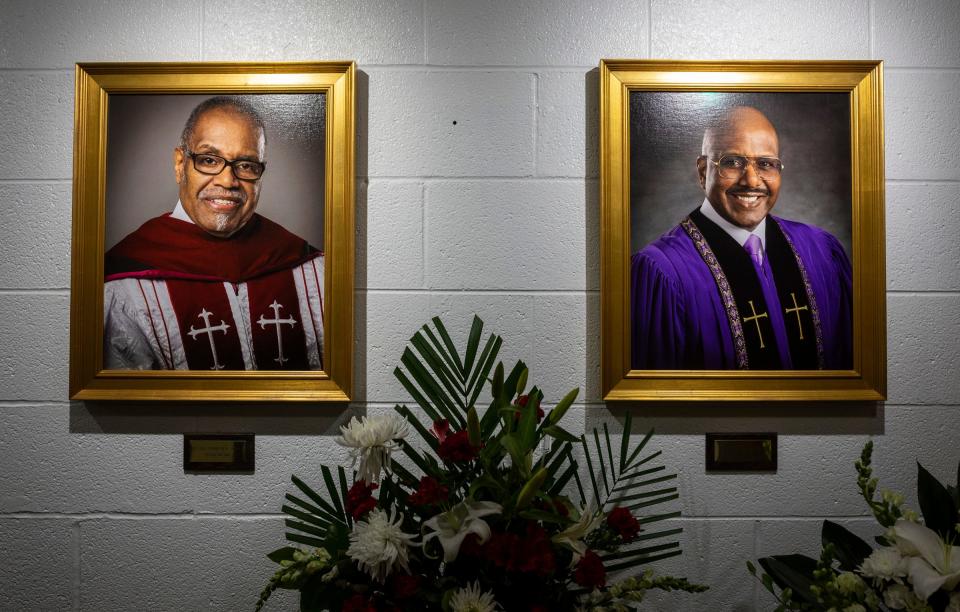 A portrait of the Rev. Charles G. Adams, left, and his son, the Rev. Charles Christian Adams, hangs inside the Hartford Memorial Baptist Church in Detroit during the funeral ceremony for the Rev. Charles G. Adams on Friday, Dec. 15, 2023.