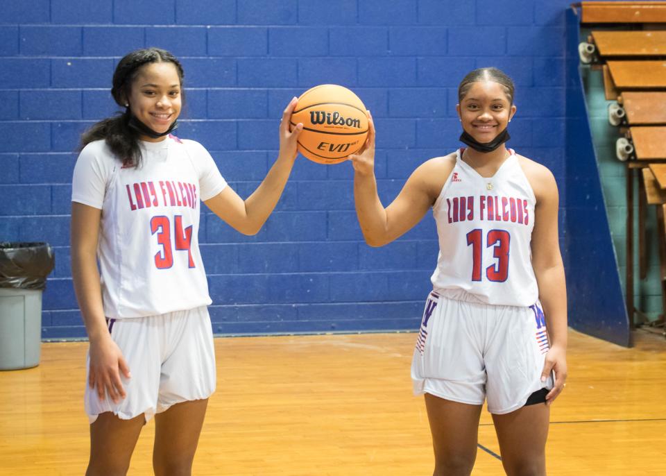 West Henderson freshman twins, Jaza Wilson, left, and Jania Wilson pose during pre-game warmups on Monday at West. [PAT SHRADER/ SPECIAL TO THE TIMES-NEWS]