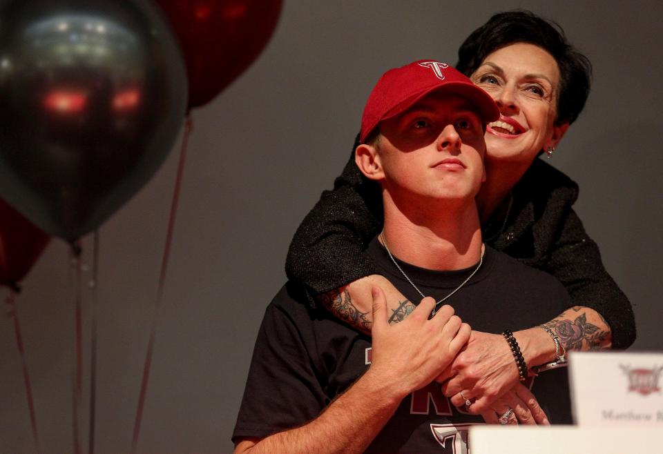 Matthew Bacon and his mother Tori Bacon celebrate his signing with Troy University during National Signing Day, Wednesday, Feb. 7, 2024, at Vero Beach High School.