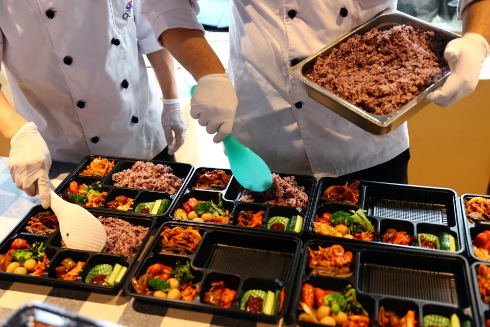 Chefs dispatched from South Korea prepare boxed meals for the country's Tokyo 2020 Olympic Games athletes at a hotel in Urayasu, Chiba Prefecture, Japan, July 26, 2021.   REUTERS/Kim Kyung-Hoon