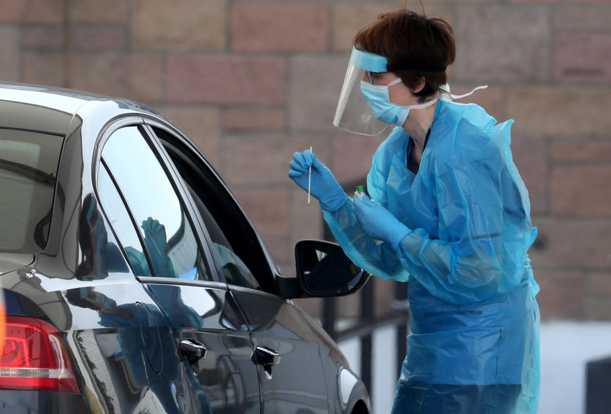 A nurse prepares to take a sample at a COVID 19 testing centre in the car park of the Bowhouse Community Centre in Grangemouth as the UK continues in lockdown to help curb the spread of the coronavirus.