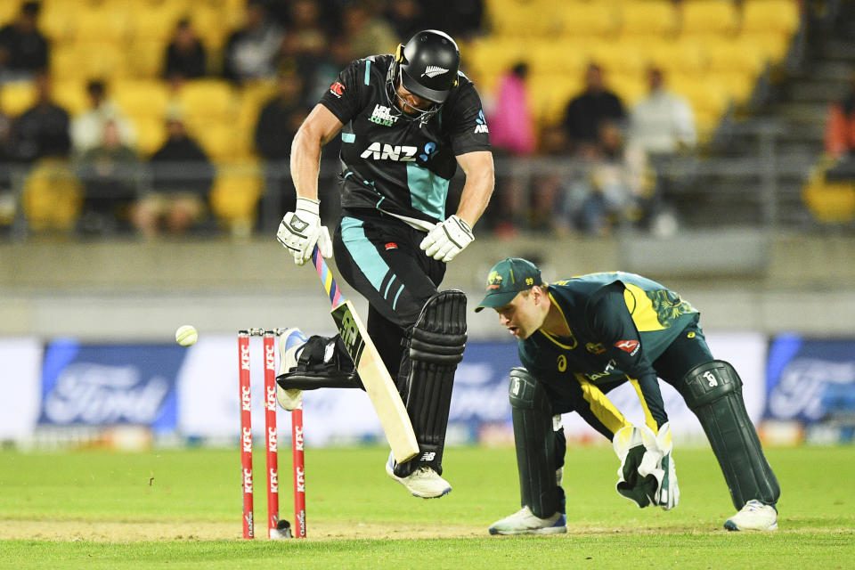 New Zealand's Glenn Phillips is airborne as he runs to make his ground during the T20 cricket international between Australia and New Zealand in Wellington, New Zealand, Wednesday, Feb. 21, 2024. (Chris Symes/Photosport via AP)