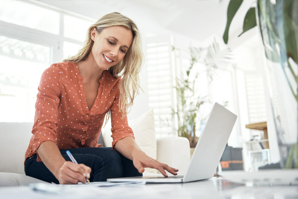 A woman working on her laptop.