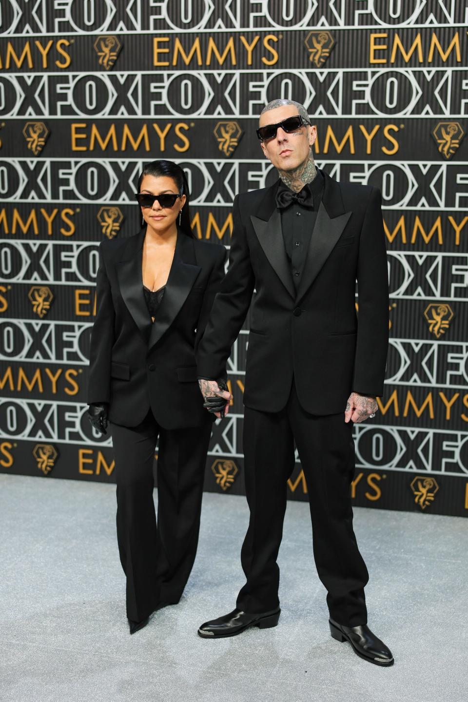 Kourtney Kardashian Barker and Travis Barker attend the 2024 Emmy Awards.