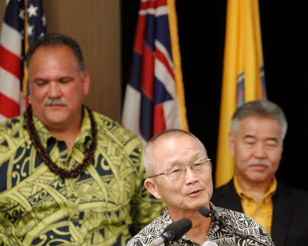 Vern Miyagi (C), administrator for the Hawaii Emergency Management Agency, speaks at a news conference discussing the newly-activated Attack Warning Tone intended to warn Hawaii residents of an impending nuclear missile attack, at the Civil Defense department at Diamond Head Crater in Honolulu, Hawaii, November 28, 2017. REUTERS/Marco Garcia