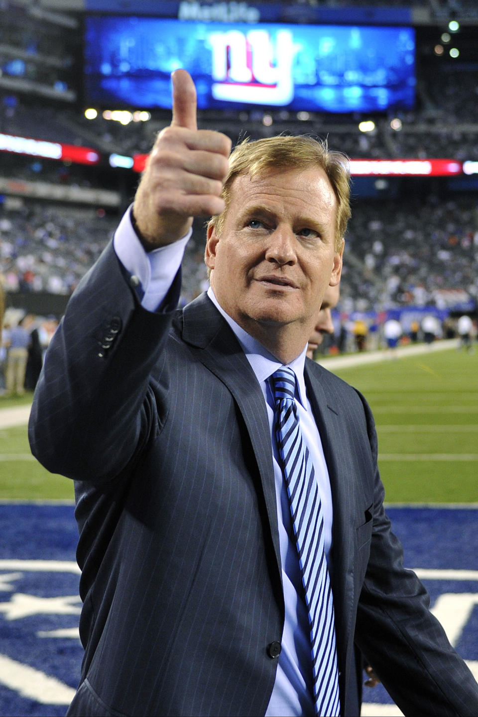 Commissioner Roger Goodell gestures to fans before an NFL football game between the New York Giants and the Dallas Cowboys, Wednesday, Sept. 5, 2012, in East Rutherford, N.J. (AP Photo/Bill Kostroun)