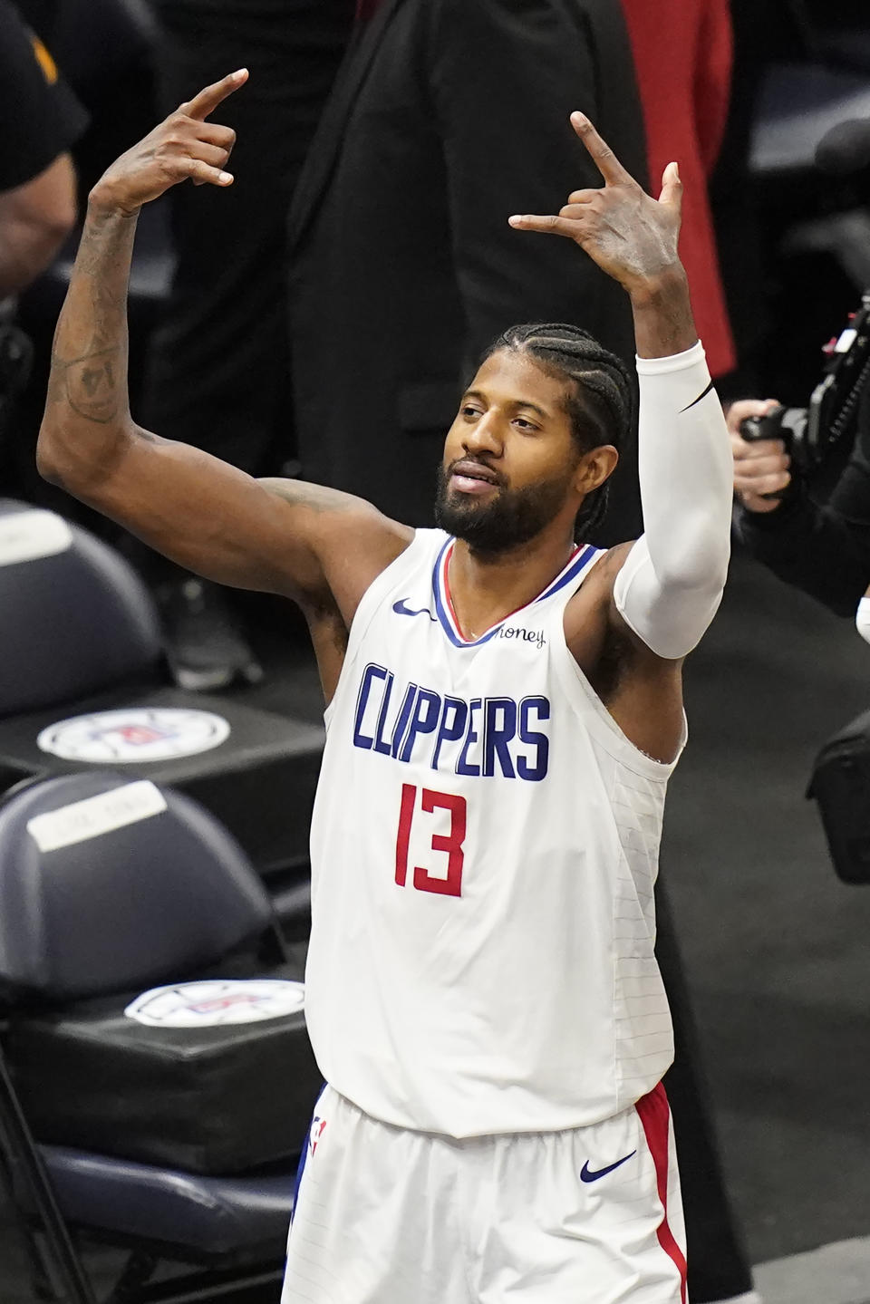 Los Angeles Clippers guard Paul George celebrates as he heads to the bench during the second half of Game 5 of the team's second-round NBA basketball playoff series against the Utah Jazz on Wednesday, June 16, 2021, in Salt Lake City. (AP Photo/Rick Bowmer)