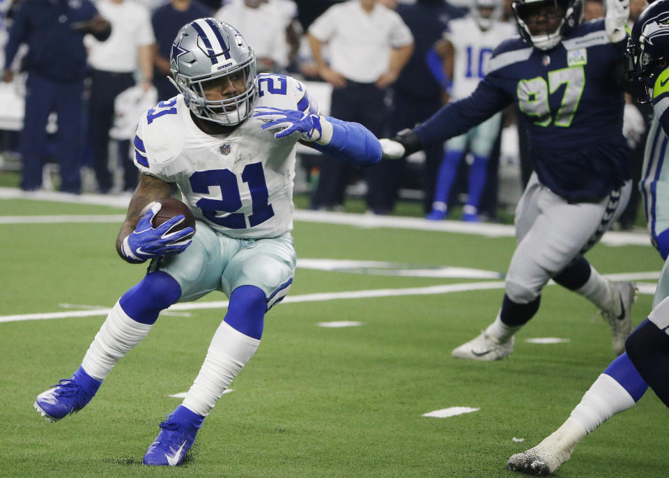 Dallas Cowboys running back Ezekiel Elliott (21) runs against the Seattle Seahawks during the first half of the NFC wild-card NFL football game in Arlington, Texas, Saturday, Jan. 5, 2019. (AP Photo/Michael Ainsworth)