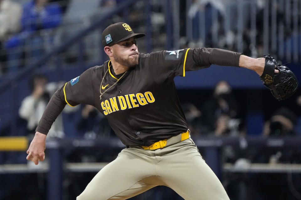 San Diego Padres starting pitcher Joe Musgrove throws to the plate during the first inning of a baseball game against the Los Angeles Dodgers at the Gocheok Sky Dome in Seoul, South Korea Thursday, March 21, 2024, in Seoul, South Korea. (AP Photo/Ahn Young-joon)