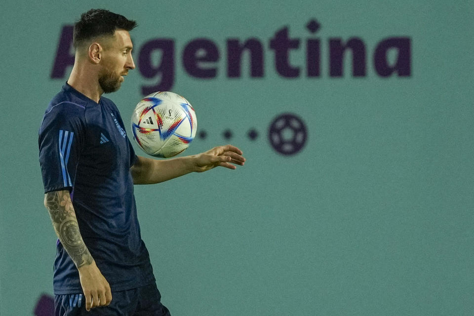 Argentina's Lionel Messi controls a ball during a training session on the eve of the round of sixteen World Cup soccer match between Argentina and Australia, in Doha, Qatar, Friday, Dec. 2, 2022. (AP Photo/Jorge Saenz)