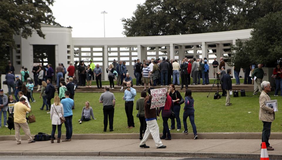 Crowds gather in Dealey Plaza at the spot of the 1963 assassination of U.S. President John F. Kennedy one day before commemorations of the 50th anniversary of the assassination in Dallas