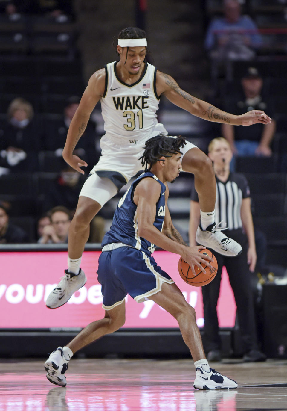 Wake Forest's Alondes Williams guards Charleston Southern's Tahlik Chavez during the first half of an NCAA college basketball game Wednesday, Nov. 17, 2021, in Winston-Salem, N.C. (Walt Unks/The Winston-Salem Journal via AP)