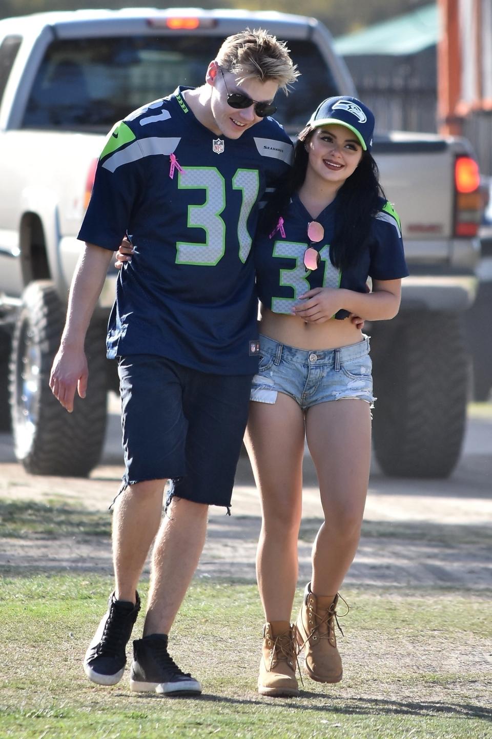 <p>The <i>Modern Family </i>actress and boyfriend, Levi Meaden, wore matching Seattle Seahawks jerseys with their names written on the back of them Sunday, as they watched their team defeat the L.A. Rams at home. (Photo: AKM-GSI) </p>