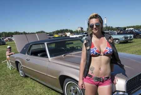 Nora Mattsson from Finland poses with her Thunderbird 1967 at the yearly Power Big Meet in Vasteras, Sweden on Friday, July 3, 2015. REUTERS/Pontus Lundahl/TT News Agency
