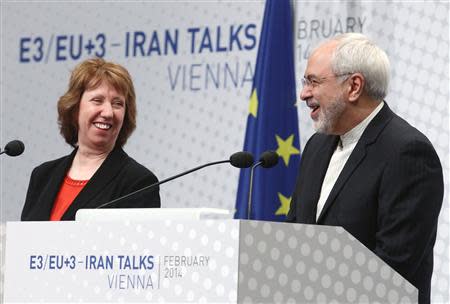 European Union foreign policy chief Catherine Ashton (L) and Iranian Foreign Minister Mohammad Javad Zarif share a laugh during a press statement after a conference in Vienna February 20, 2014. REUTERS/Heinz-Peter Bader