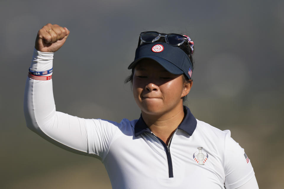 United States' Danielle Kang celebrates after putting on the 8th green during her foursome match with partner United States' Lexi Thompson at the Solheim Cup golf tournament in Finca Cortesin, near Casares, southern Spain, Saturday, Sept. 23, 2023. Europe play the United States in this biannual women's golf tournament, which played alternately in Europe and the United States .(AP Photo/Bernat Armangue)