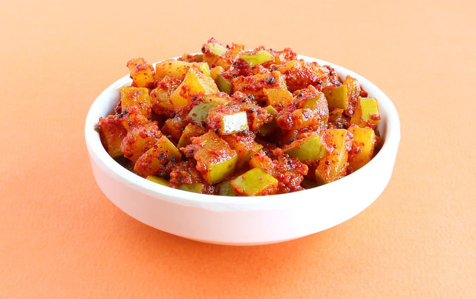 Raw mango pickle in a bowl.