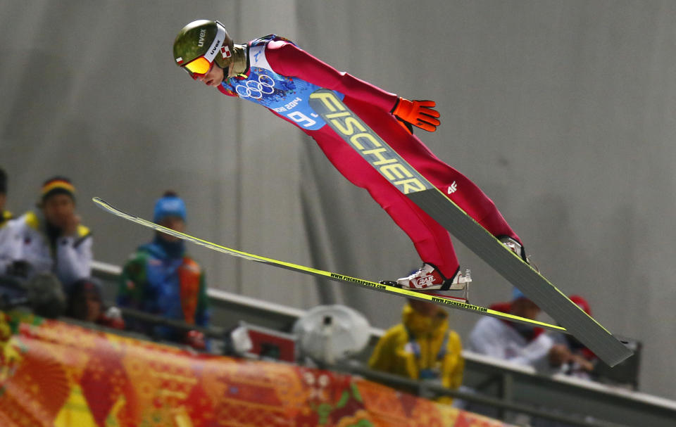 Poland's Kamil Stoch makes his trial jump during the ski jumping large hill team competition at the 2014 Winter Olympics, Monday, Feb. 17, 2014, in Krasnaya Polyana, Russia. (AP Photo/Dmitry Lovetsky)