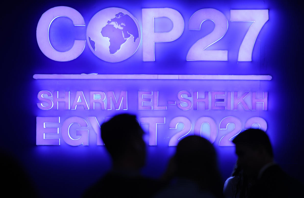 A sign is illuminated in the plenary hall at the  COP27 climate conference in Sharm el-Sheikh, Egypt. 
