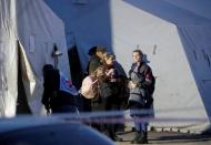 Evacuees from Azovstal steel plant arrive at a temporary accommodation centre in Bezimenne