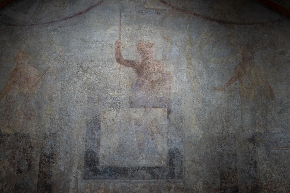 A detail of the frescoes coming from the sacellum, a small votive chapel, of a two-story home, or "Domus," dating from around 134-138 AD that was partially destroyed to make way for the construction of the Caracalla public baths, which opened in 216 AD, are on display at the Caracalla archaeological park in Rome, Thursday, June 23, 2022. The frescoed ceiling and walls of a domestic temple honoring Greco-Roman and Egyptian religious deities and believed to have belonged to a wealthy merchant family were first discovered in the mid-19th century about 10 meters (yards) underneath the current ground level of the baths, had been briefly exhibited but has been closed to the public for 30 years. (AP Photo/Domenico Stinellis)