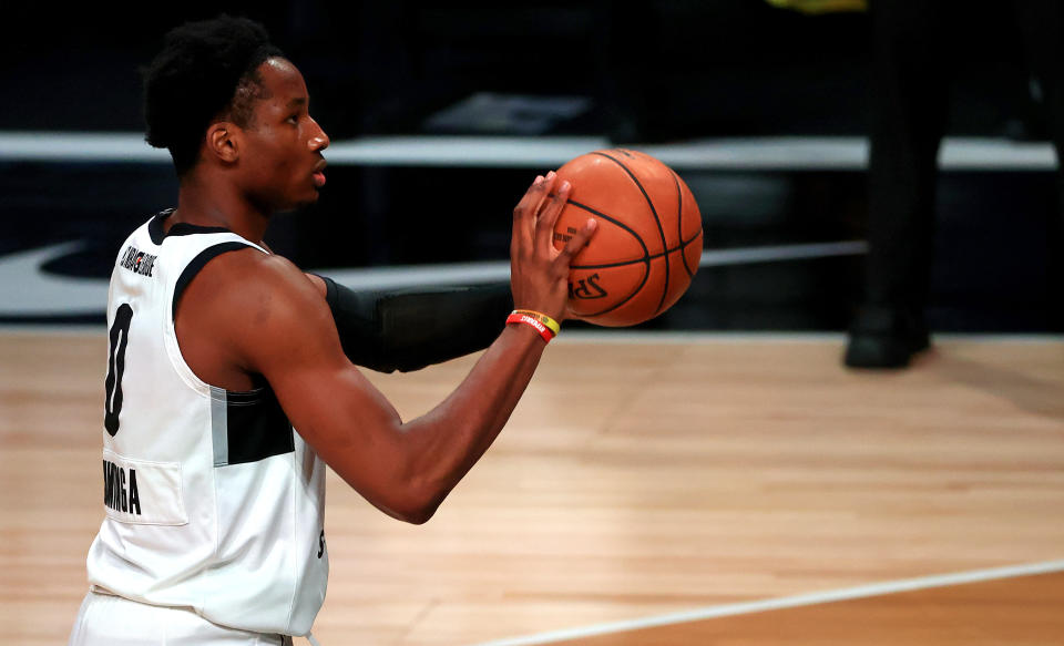 LAKE BUENA VISTA, FLORIDA - FEBRUARY 18: Jonathan Kuminga #0 of the G League Ignite shoots during a G-League game against the Westchester Knicks at AdventHealth Arena at ESPN Wide World Of Sports Complex on February 18, 2021 in Lake Buena Vista, Florida.