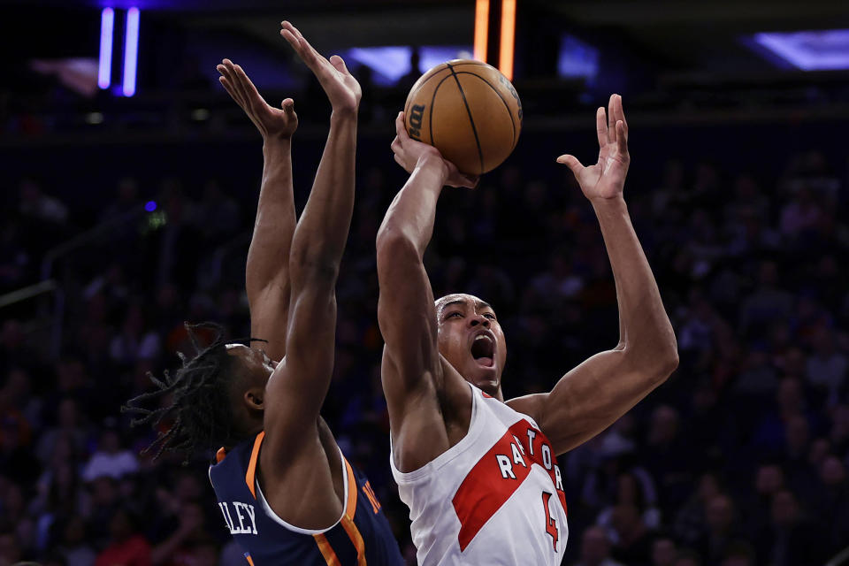 Toronto Raptors forward Scottie Barnes (4) shoots in front of New York Knicks guard Immanuel Quickley, left, during the first half of an NBA basketball game Monday, Jan. 16, 2023, in New York. (AP Photo/Adam Hunger)