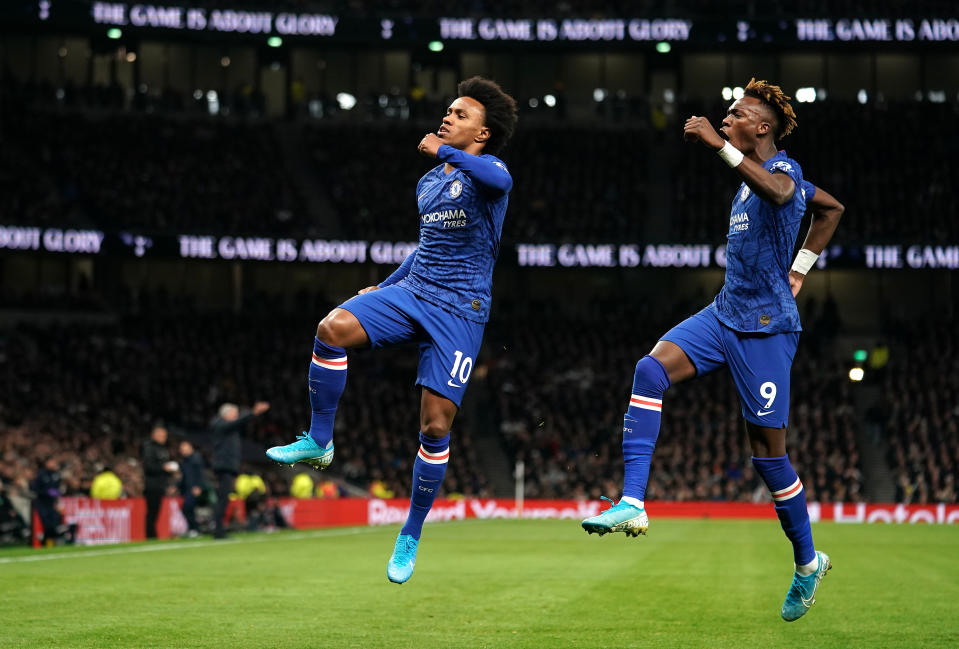 Chelsea's Willian (left) celebrates scoring his side's first goal of the game with team-mate Tammy Abraham Tottenham Hotspur v Chelsea - Premier League - Tottenham Hotspur Stadium 22-12-2019 . (Photo by  John Walton/EMPICS/PA Images via Getty Images)