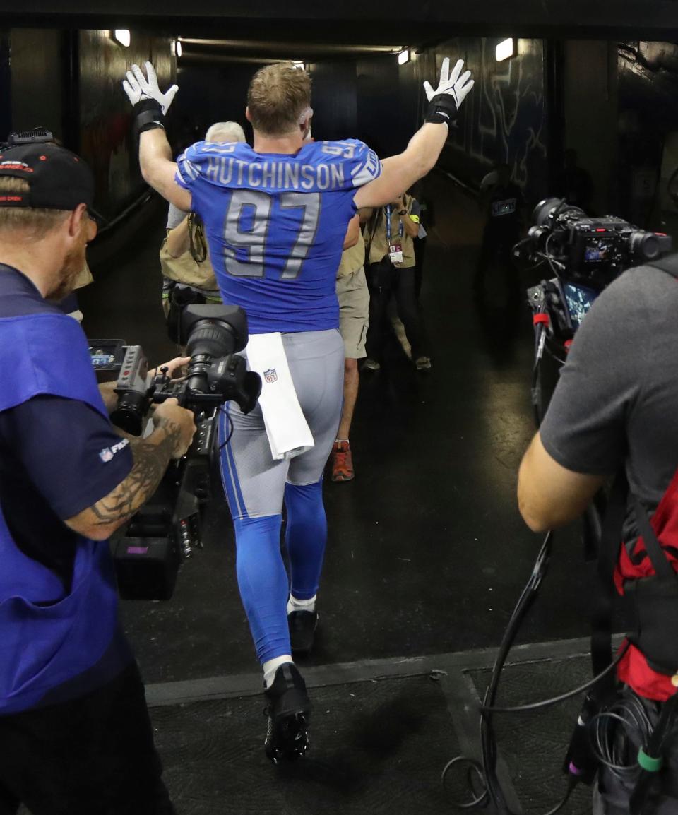 Detroit Lions defensive end Aidan Hutchinson waves to fans after the 36-27 win over the Washington Commanders at Ford Field, Sept. 18, 2022.